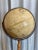 Vintage “Word Classic” model, Replogle Made in USA, tan terrestrial globe in wood and metal stand.
