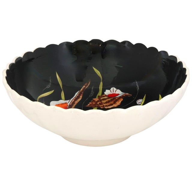A scalloped Henriot Quimper serving bowl hand-painted by celebrated artist Guy Trévoux. Finished in the distinctive black...