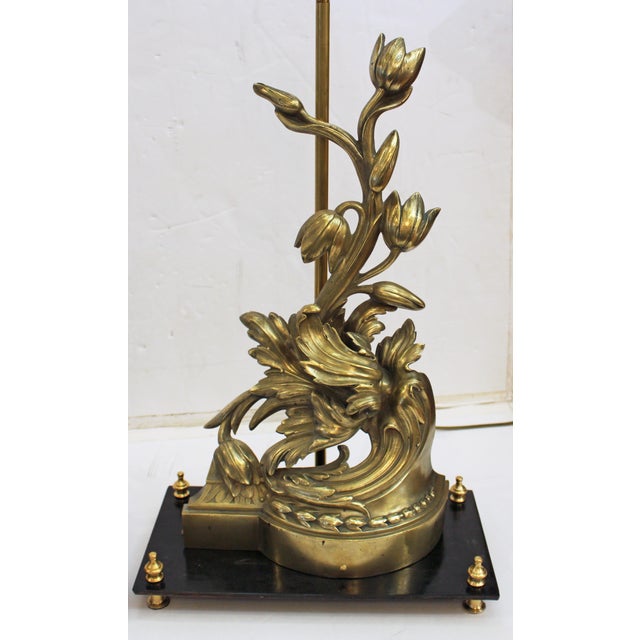 Mid-late 19th century pair of French bronze chenets mounted as lamps. Sculpturally cast in exuberant floral, acanthus leaf...