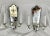 A beautiful pair of 1920a mirrored wall sconces, featuring elegantly etched and carved glass backplates that reflect light...