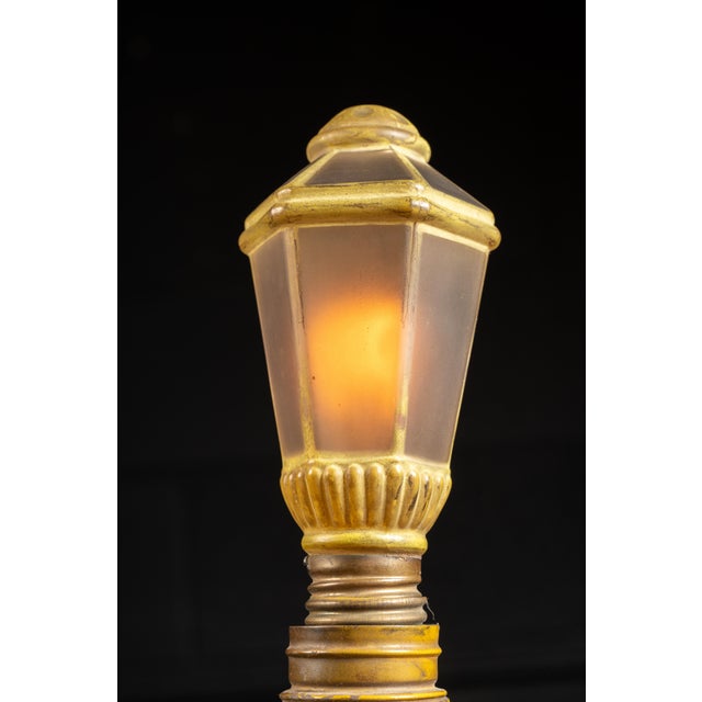 c. 1910s/1920s Art Nouveau blacksmith lamp, made in Germany. This figural lamp takes the form of a blacksmith in the...