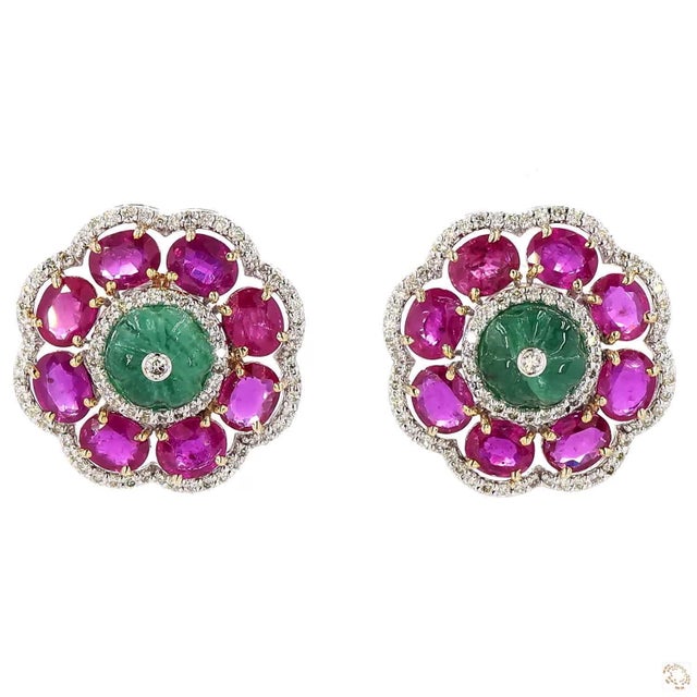These estate earrings from our contemporary estate collection centers on a 0.95-carat diamond in a round brilliant cut for...