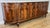 An exceptional vintage French Empire sideboard, beautifully designed with a striking marble top and rich decorative...