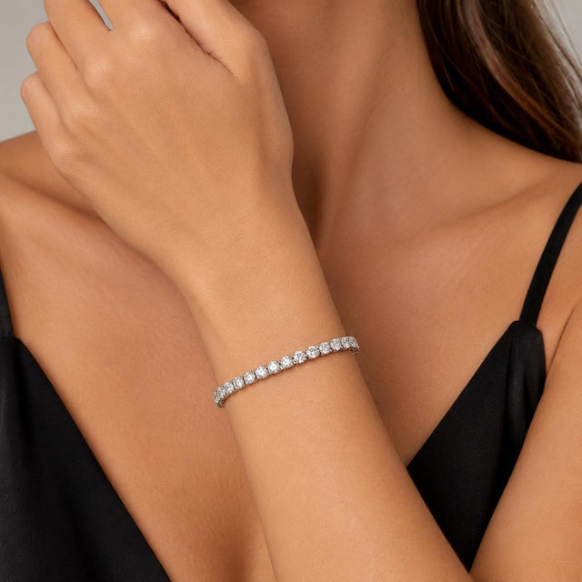 14k White Gold Bracelet with round white diamonds weighing approximately 3.50 carats. 12.45g