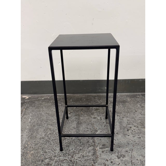 Design Plus Gallery presents the Slim Side Table from Room & Board. This modern design pairs a square metal top with a...