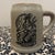 This vintage stoneware mug is a classic piece of American advertising pottery, specifically associated with Monmouth...