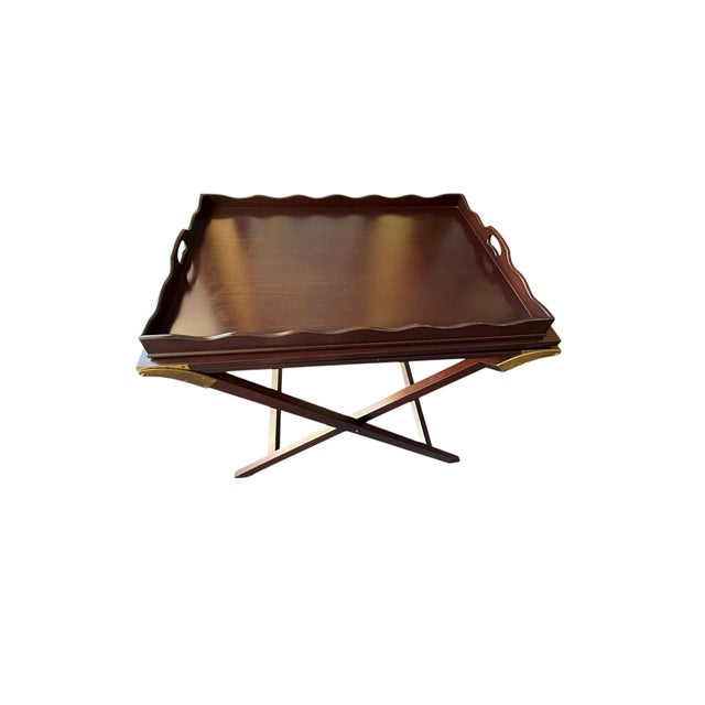 Mahogany tray table that unfolds to 89" in length. The table made by Baker Furniture in the 1950's is called the "Party...