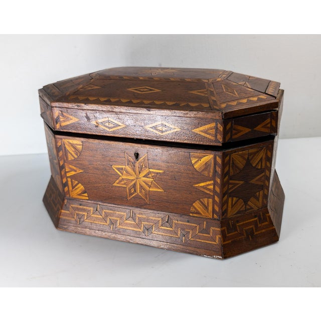 We are selling this simple 19th or 20th Century American Folk Tramp art Box. This box has unique inlaid Marquetry or...