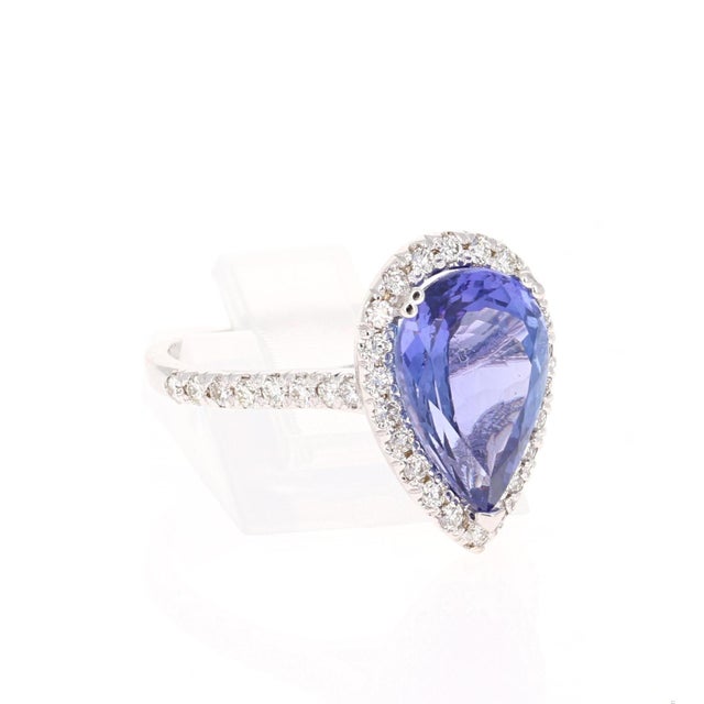 Elegant & Magnificent, Classic Tanzanite & Diamond Ring! This ring has a beautiful Pear Cut Tanzanite weighing 3.90...