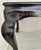 A late 19th century black japanned Chinoiserie side table, adorned in delicate gilded floral motifs, with apron fronts,...
