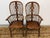 Design Plus Gallery presents a Pair of English Windsor Armchairs from Antonio's Antiques. This pair displays a classic...