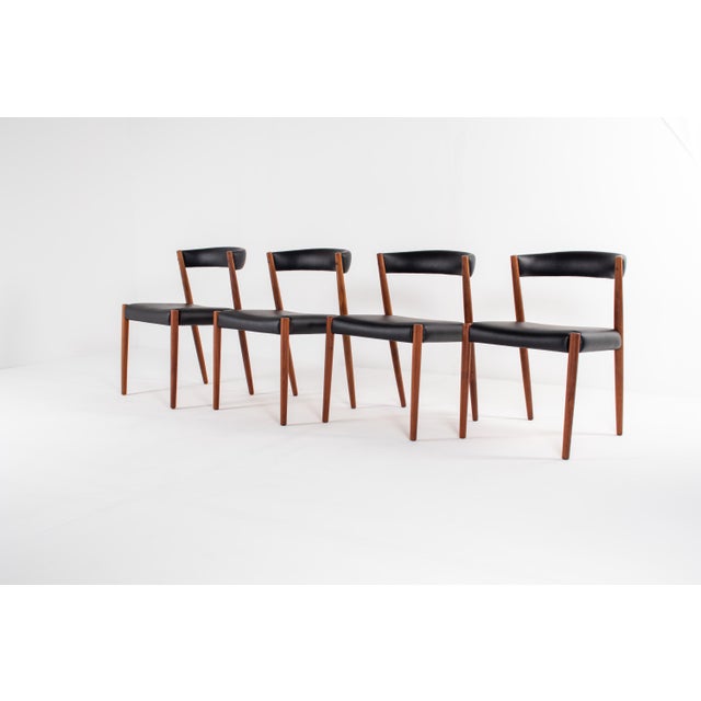 Beautiful set of four Danish Modern dining chairs from the 1960s, crafted in solid teak. The chairs feature an elegant,...