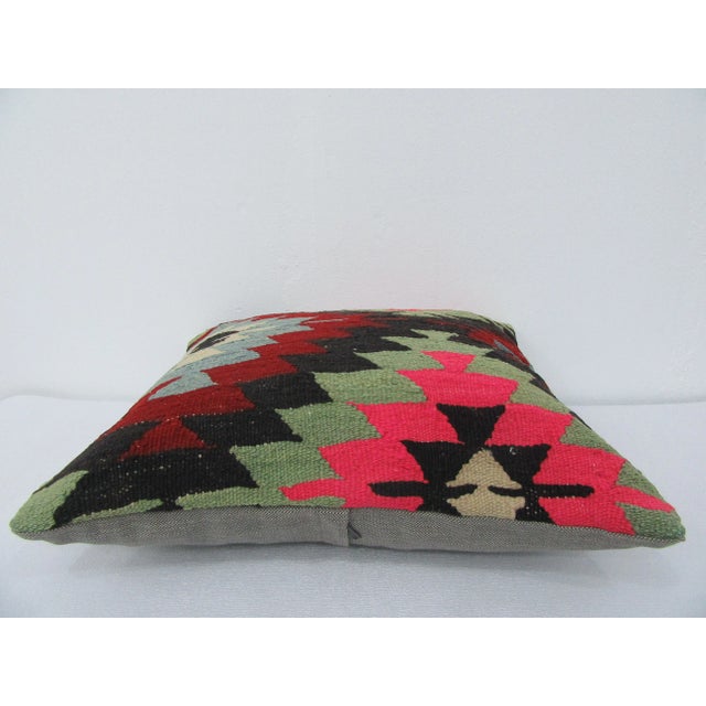 This is a pillow cover made from a vintage kilim rug. The piece was properly washed and ready to use. Pillow inserts not...