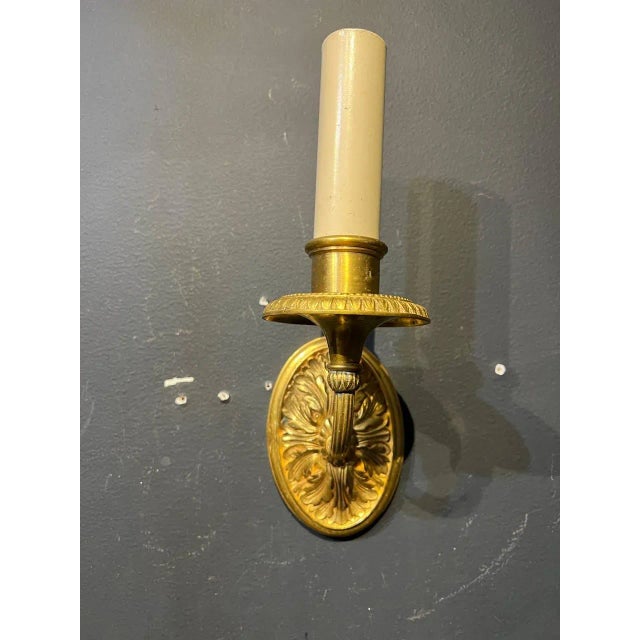 A circa 1920's Caldwell gild bronze one light sconces