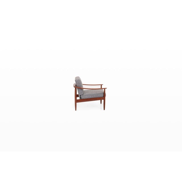 Vintage easy chair produced by carl straub, produced in the 1960s. This elegant armchair features a solid teak frame and...