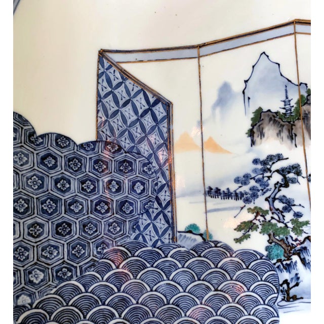 This massive Japanese Arita plate was made in Hizen, circa 1890-1910s, at the end of Meiji period by a potter named...