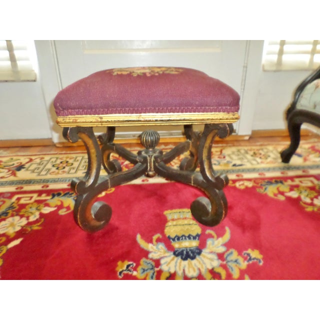 This is a Late 1700s Antique Baroque Footstool with Scroll Feet and Dark Wood that is most probably Mahogany with Gilded...