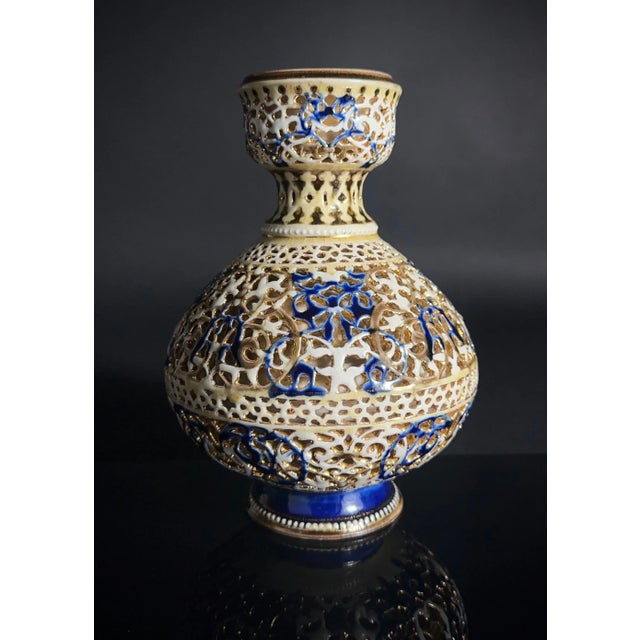 **Rare Item** Zsolnay double walled reticulated porcelain vase. Cobalt blue, cream, and gold. The underside is marked...