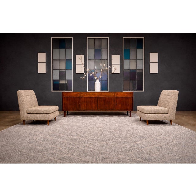 Designed by Joaquim Tenreiro (1906–1992), this pair of L-Shape armchairs exemplifies the designer’s modernist commitment...