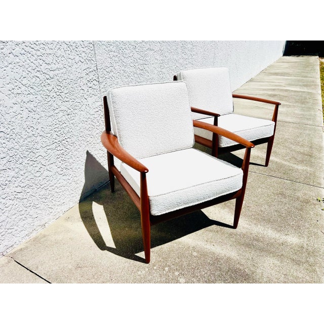 A gorgeous pair of Danish teak lounge chairs designed by Grete Jalk for France & Daverkosen. These have been restored with...
