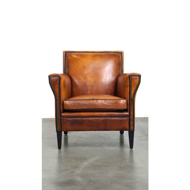 This charming armchair has a beautiful, sleek design and is crafted from high-quality sheepskin. It boasts a beautiful,...