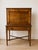 A handsome 19th-century writing desk featuring warm, richly figured wood and an elegant, restrained silhouette. The upper...