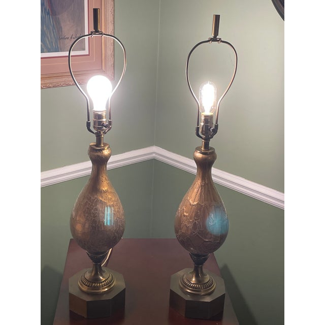 These striking table lamps are vintage Mid-Century Modern (MCM), frequently identified as being in the "Genie Bottle" or...