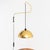 Italian wall lamp made of brass with pivot arm and black cable hanging down lampshade (ø40 cm). The switch functions as a...