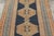 Handwoven in wool, circa 1910–1920, this antique 4x6 Kurdish rug features bold geometric medallions across a dramatic...