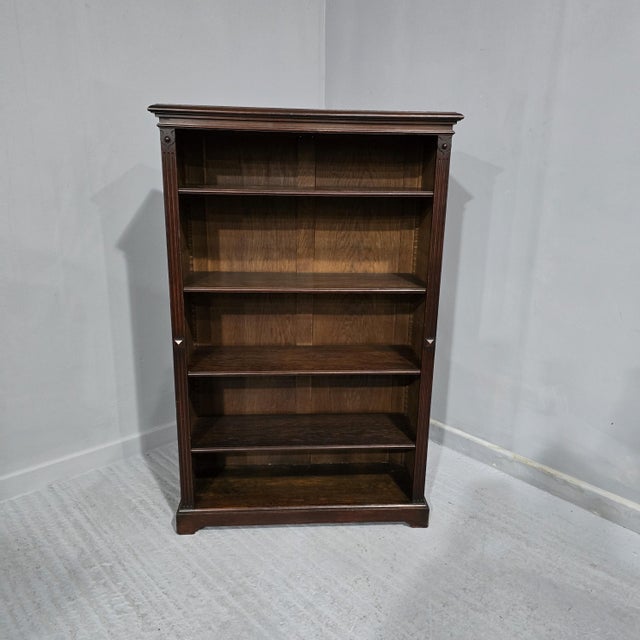 A very good quality solid oak open adjustable library bookcase, four oak shelves, in overall excellent condition. 55.25"...