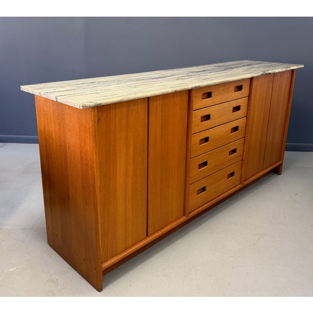 This exceptional American studio–made sideboard exemplifies the refined craftsmanship and architectural restraint...