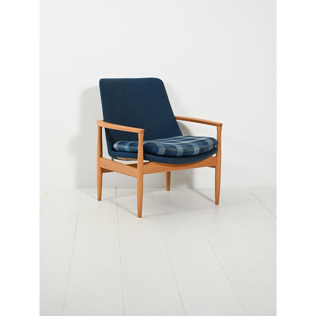 1950s–60s, turned oak and original blue wool upholstery. Removable seat cushion with a checked pattern. Mid-century...