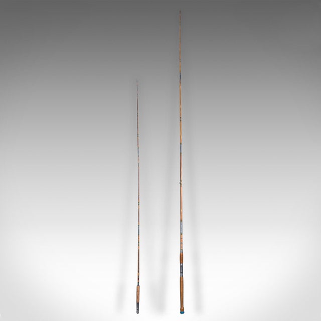 This is a vintage 2 fishing rod Case. A Japanese, bamboo rod duo within a pine carry case, dating to the mid 20th century,...