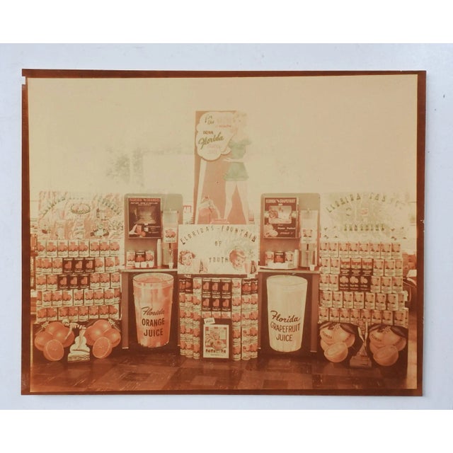 Vintage mid century cibachrome highly glossy (front & back) color photograph of an advertising display for Florida orange...