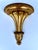 An Italian giltwood wall bracket with a shaped, semicircular shelf above a flared support, acanthus leaf decoration and a...