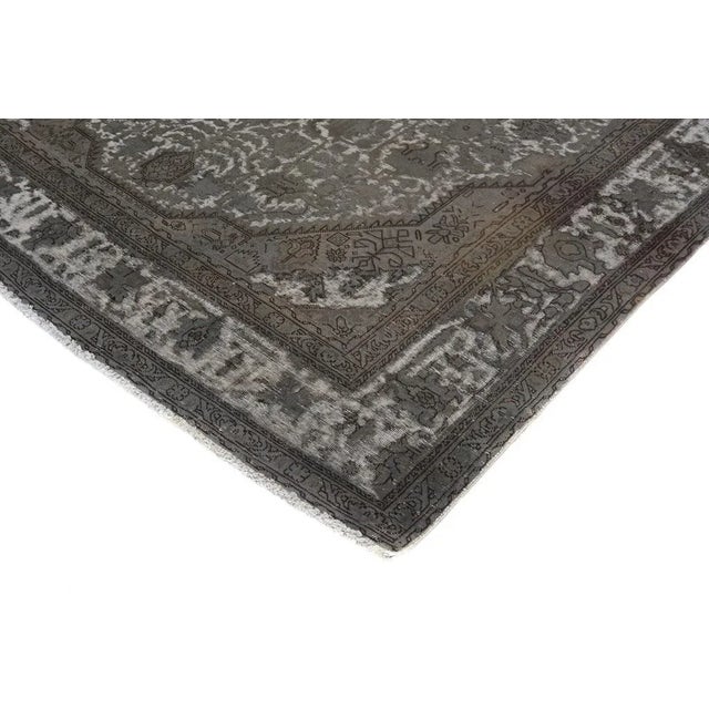 Stunning vintage rug hand knotted superbly using the finest quality wool to give it an excellent distressed look and...