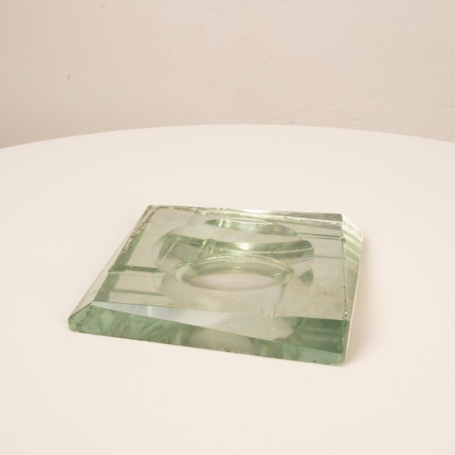 An extraordinary solid crystal ashtray designed by Pietro Chiesa for Fontana Arte in the 1940s. The work perfectly...