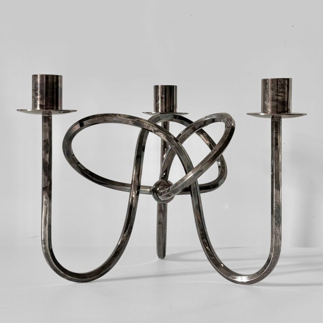 An iconic Swedish candlestick, model Vänskapsknuten (The Knot of Friendship), designed in 1938 by Austrian-Swedish...
