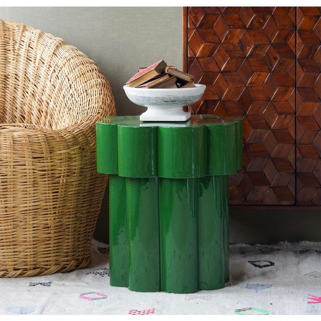 Add a vibrant pop of luck and color with the Emerald Side Table. The flower-shaped, iron tabletop sits atop a thick, inset...