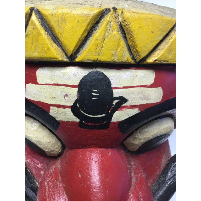 Our mounted mask will add culture and character to any room. Hand-carved wood, detailed features, great colors. Metal stem...