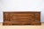 A large blanket chest, c. 1880, Italian. Features raised geometric panelling, a dentil frieze along the underside of the...