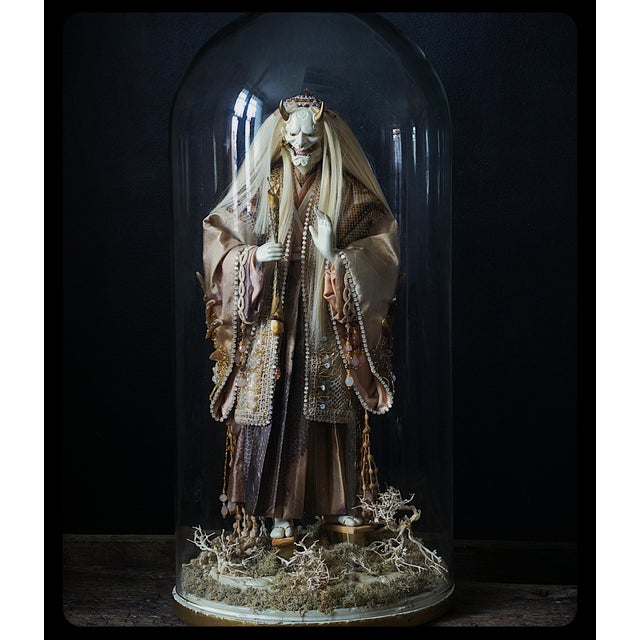 This striking artistic figure draws inspiration from the iconography of japanese noh theater and folklore. The face,...