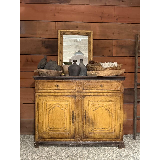 This hand-crafted French sideboard dates to the late 1700s to early 1800s and features classic Provençal design with Louis...