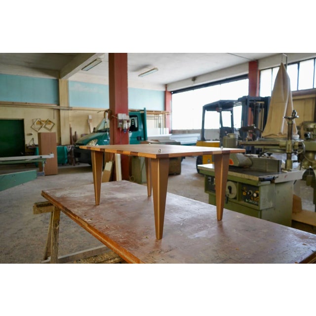 Beautiful coffee table in Slavonian oak with pass par tout in cherry and symmetrical perimeter blocks of various essences,...