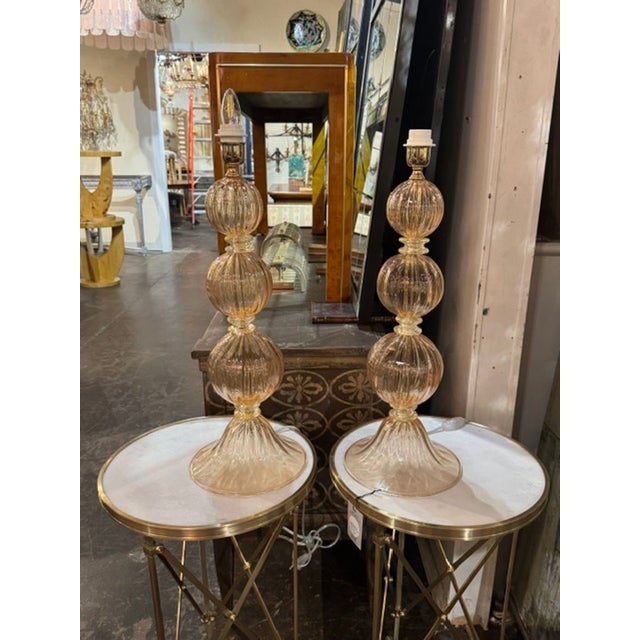 This product is a pair of large scale Murano peach ball form lamps. Beautiful color and large scale makes these an eye-...