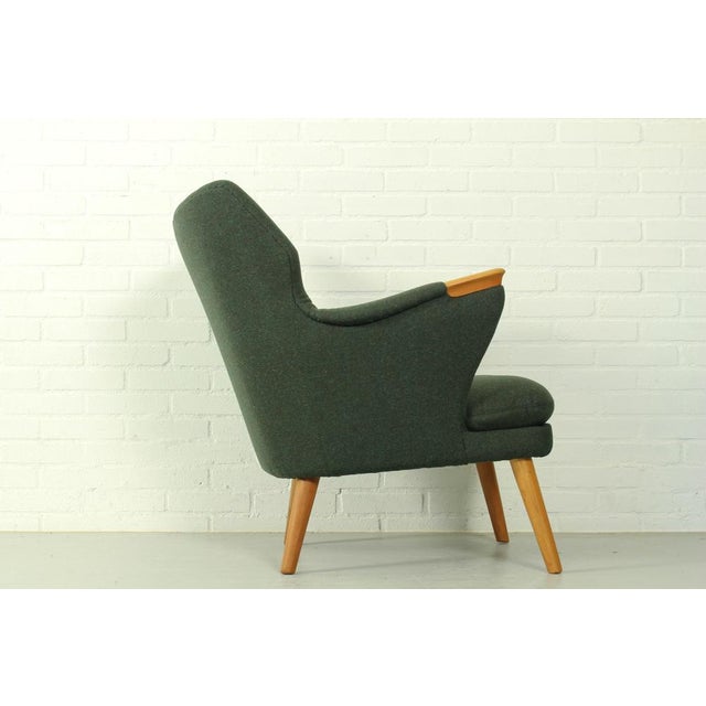 Kurt Olsen lounge chair model 221, manufactured by Slagelse Møbelværk in about 1960. Completely renovated in quality dark...
