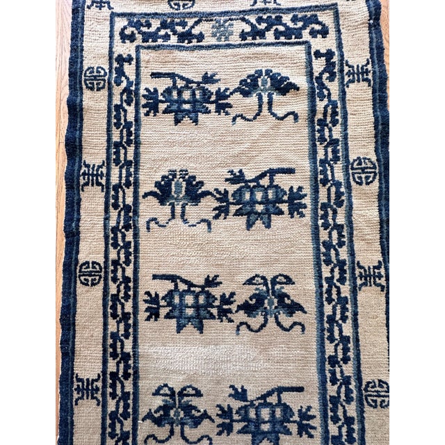 This exquisite Antique Chinese runner, woven in the distinguished Peking style circa 1870, features a rare and sought-...