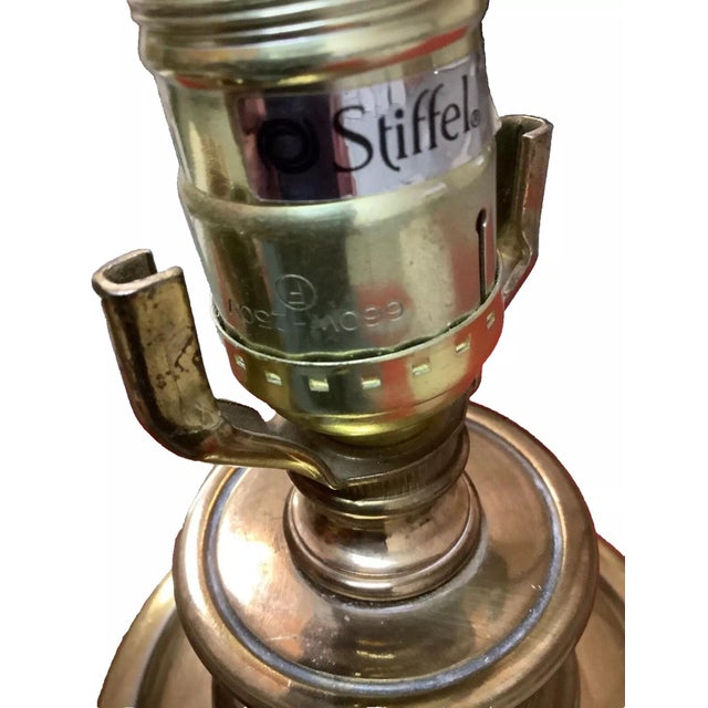 Forged vintage Stiffel brass table lamps. This classic baluster style lamp comes with its original pleated shades. Base is...