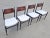In this listing you will find a gorgeous and very rare set of 4 Mid-Century Modern dining chairs in the style of Paolo...