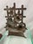 Antique doorstop of a rose bush in a barrel with a trellis. This doorstop was probably used outdoors since there is quite...